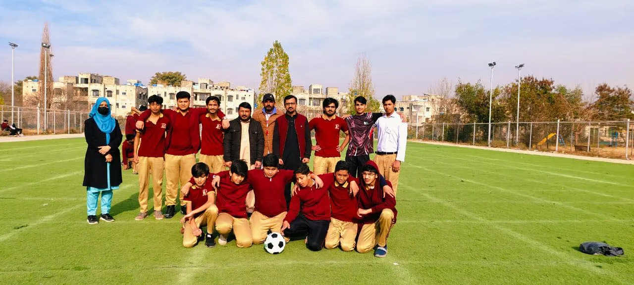 A Nurture football team gathered on the field